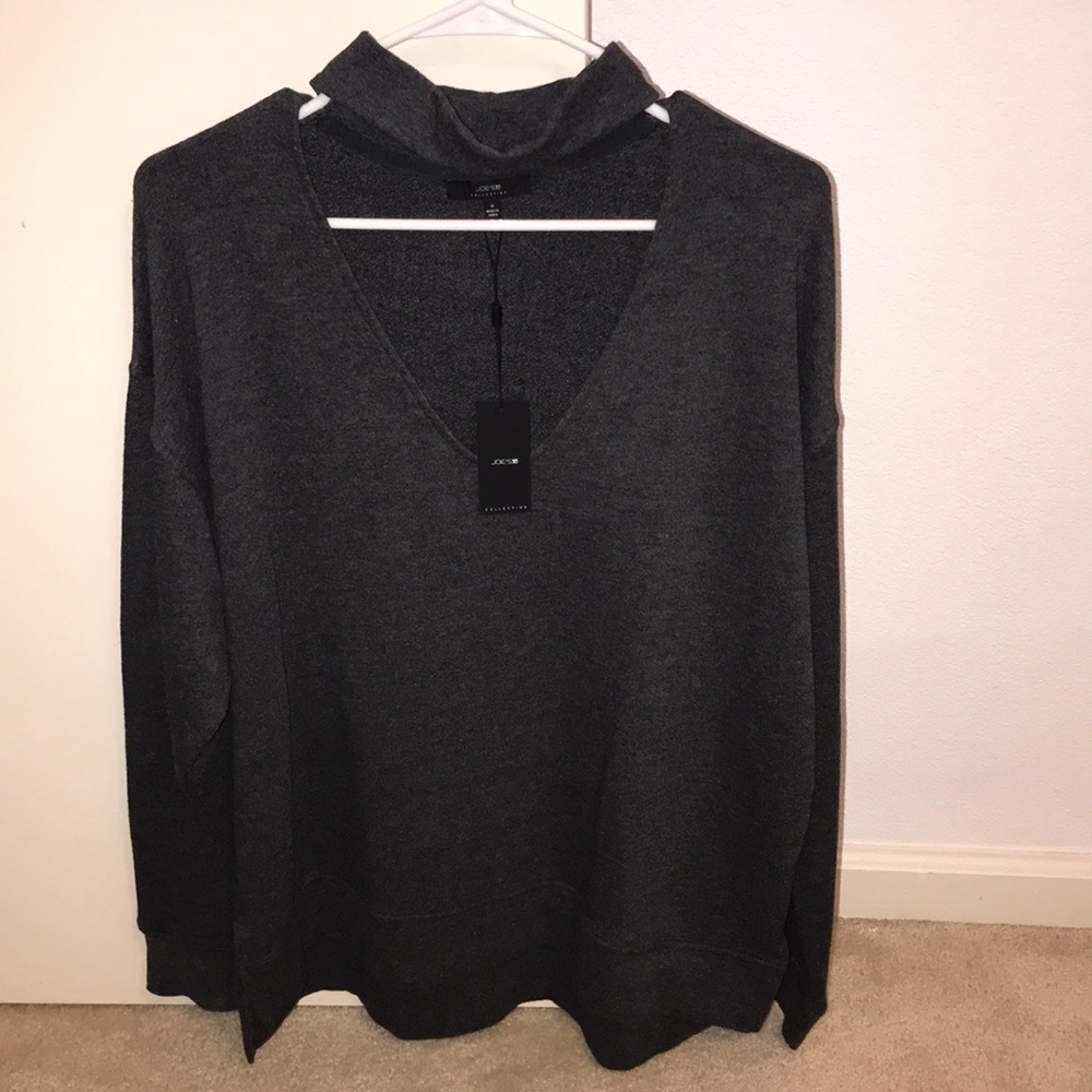 Gray sweater with low cut neck